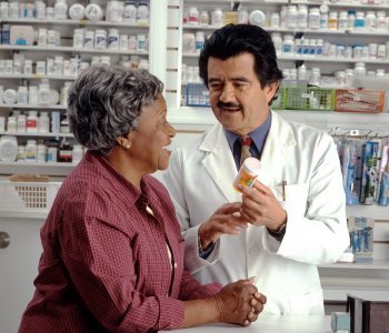pharmacist talking to woman